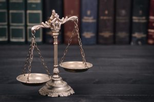 Scales of justice on a black background