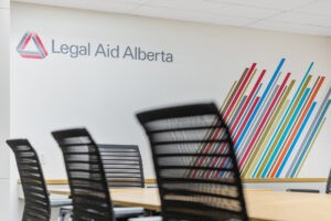 Empty chairs in a legal aid board room
