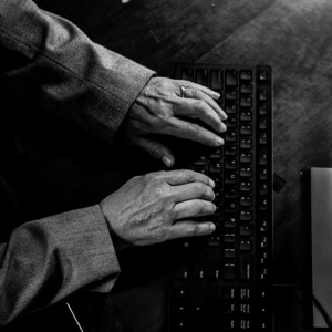 Person with hands on keyboard
