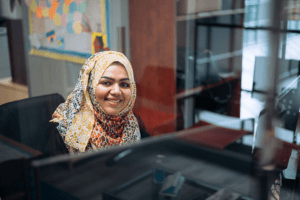 Photo of woman behind glass wall