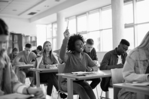 student raising hand in class