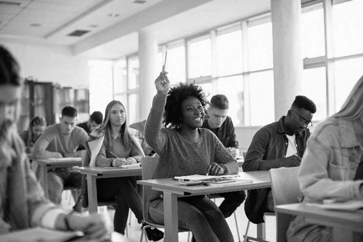student raising hand in class