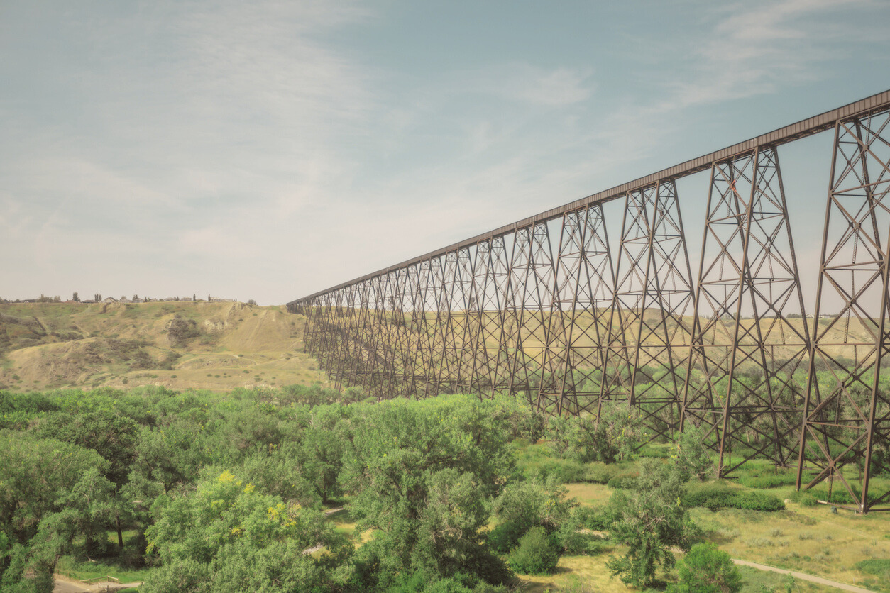 Railway bridge and stair case footpath meeting at horizon in Lethbridge