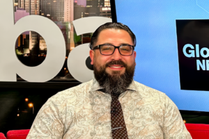 Smiling photo of Legal Aid Alberta lawyer on the Global Edmonton morning show tv set